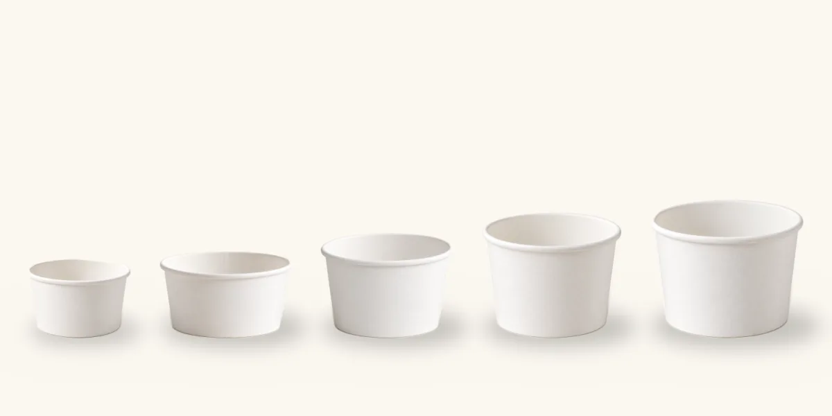Five white paper ice cream cups in a row from 4 oz to 16 oz, to scale
